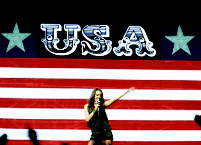Майли Сайръс в клипа Party In The USA