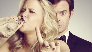 Ейми Шумър и Бил Хейдър на плакат за Trainwreck