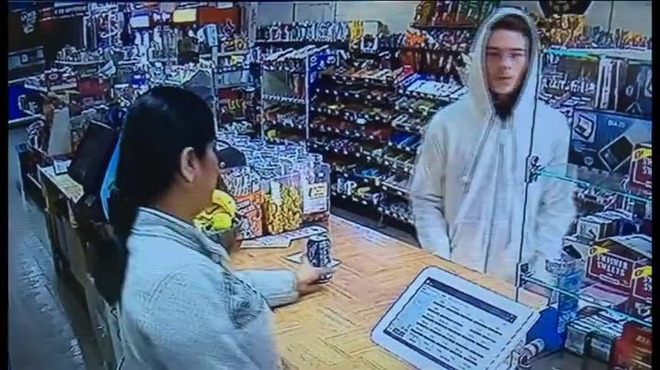 A cashier wrestles with an armed robber in the US state of Georgia.