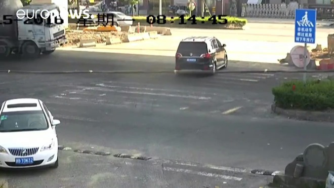 Chinese couple miraculously survive their car being crushed by cement-tanker
